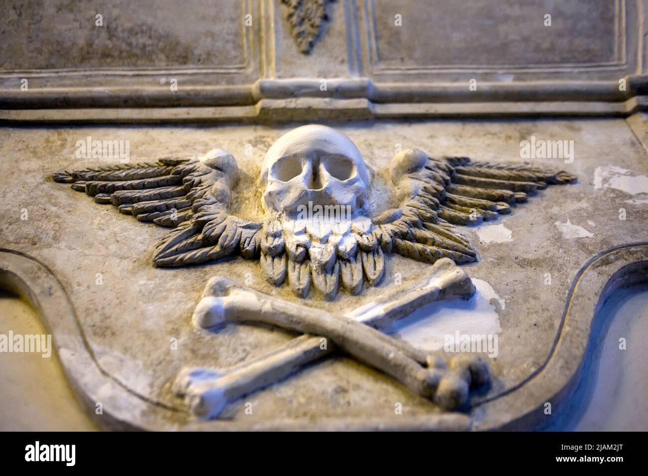 Skull and crossbones moulding, St. Audeon's Church, Dublin. Nothing to do with pirates - the symbol, and the hourglass above it refer to death, decay, Stock Photo