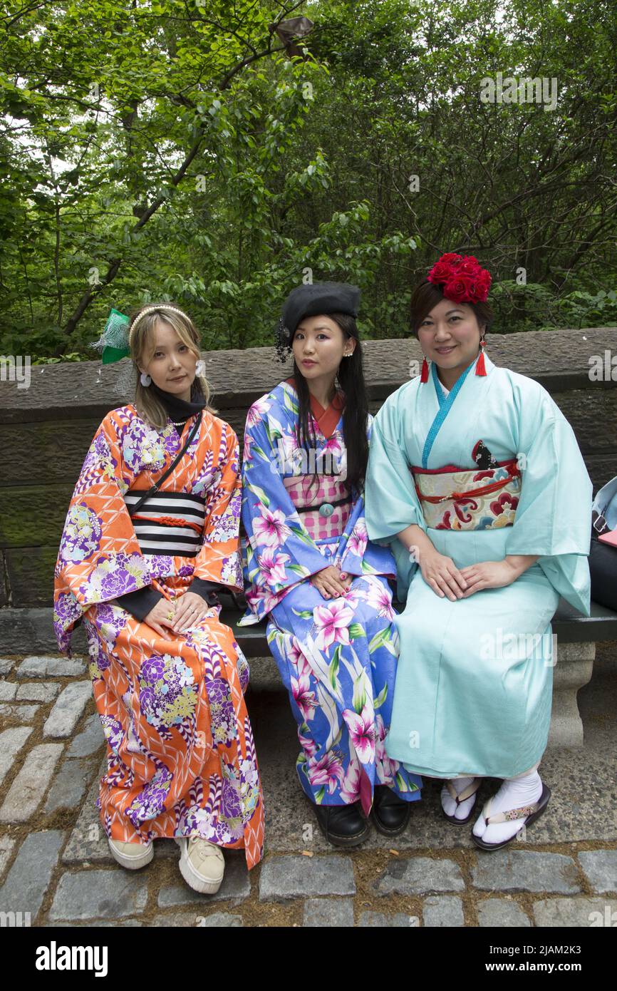 First ever Japan Day Parade on Central Park West in Manhattan on May 15, 2022 in New York City. Women dressed in beautiful kimonos at the Japan Day Parade.   Long, loose robes with wide sleeves and tied with a sash, originally worn as a formal garment in Japan and now also used elsewhere as a robe. Stock Photo