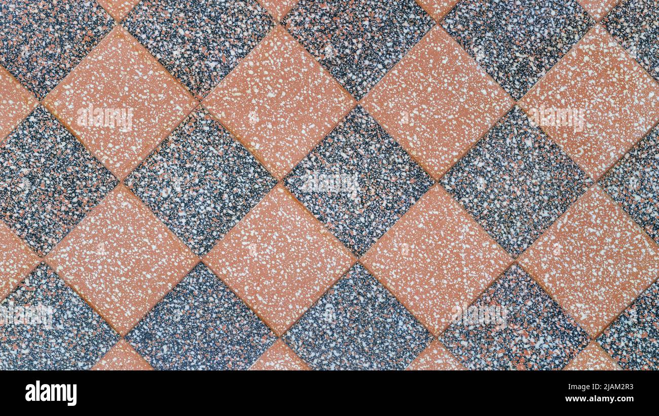 Checkered stone covering top view. Spotted checkered stone  texture and background Stock Photo