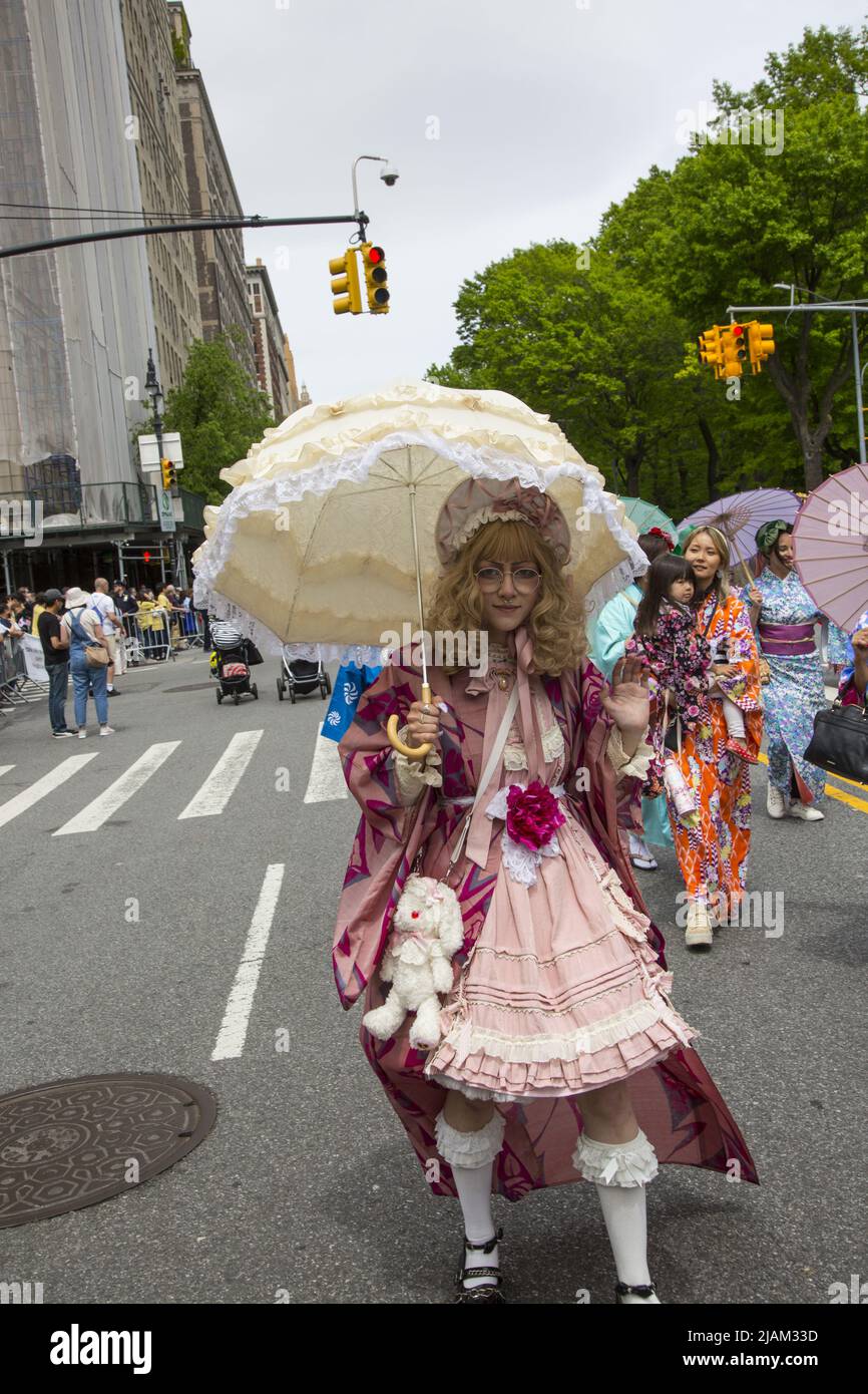 First ever Japan Day Parade on Central Park West in Manhattan on May 15, 2022 in New York City. Lolita Club inspired costumes on young women at the parade, a mixture of Victorian and childlike dress that began in Japan. Stock Photo