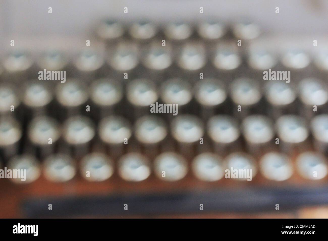 Blurry dreamy view of a set of vintage typewriter keys standing in rows