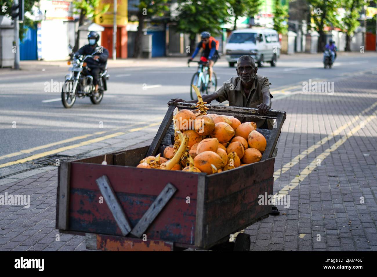 King coconut vendor on the road Stock Photo