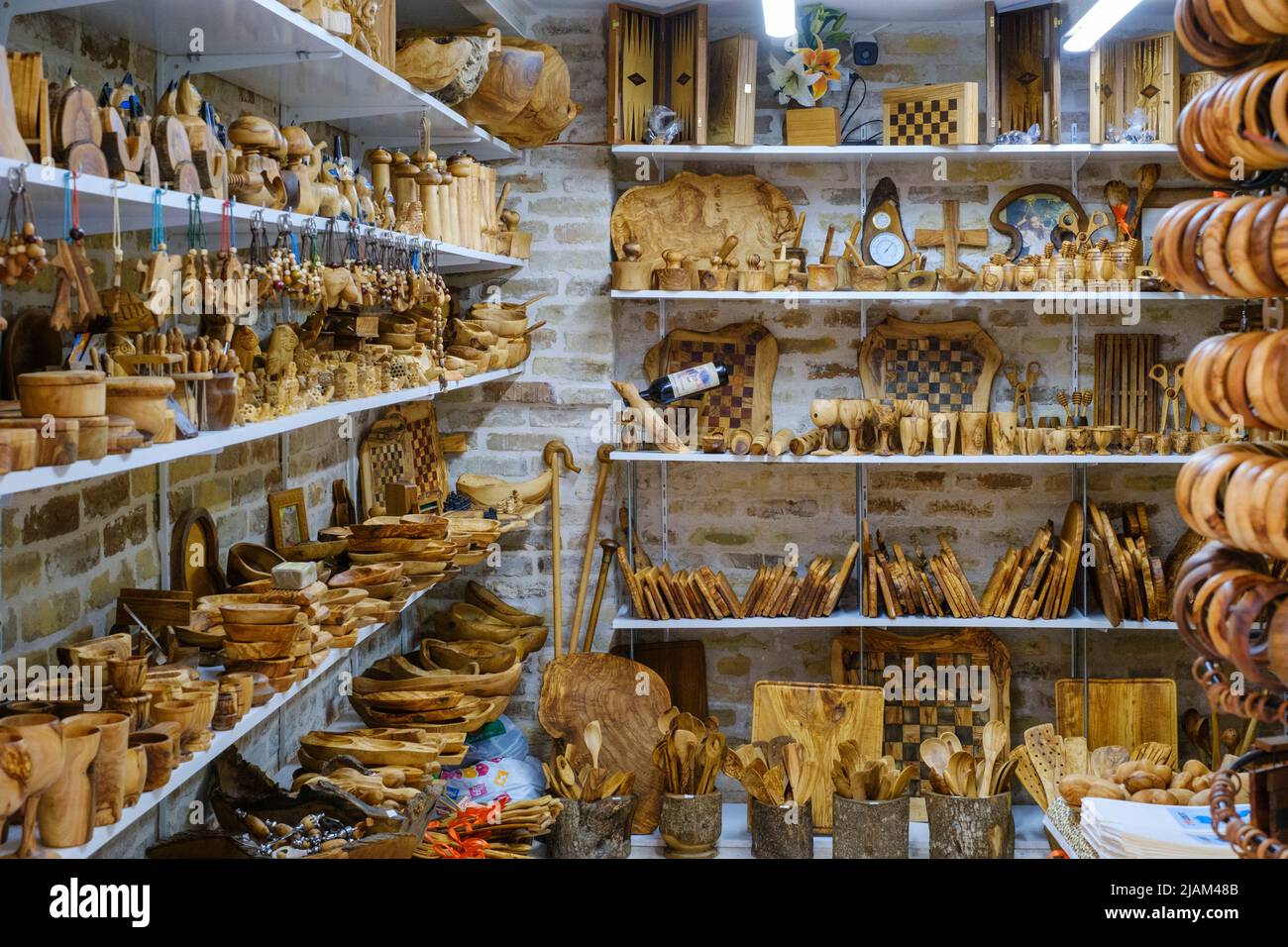 Olive wood market stall with tourist souvenirs, Corfu Town, Corfu or Kerkyra, Greece Stock Photo