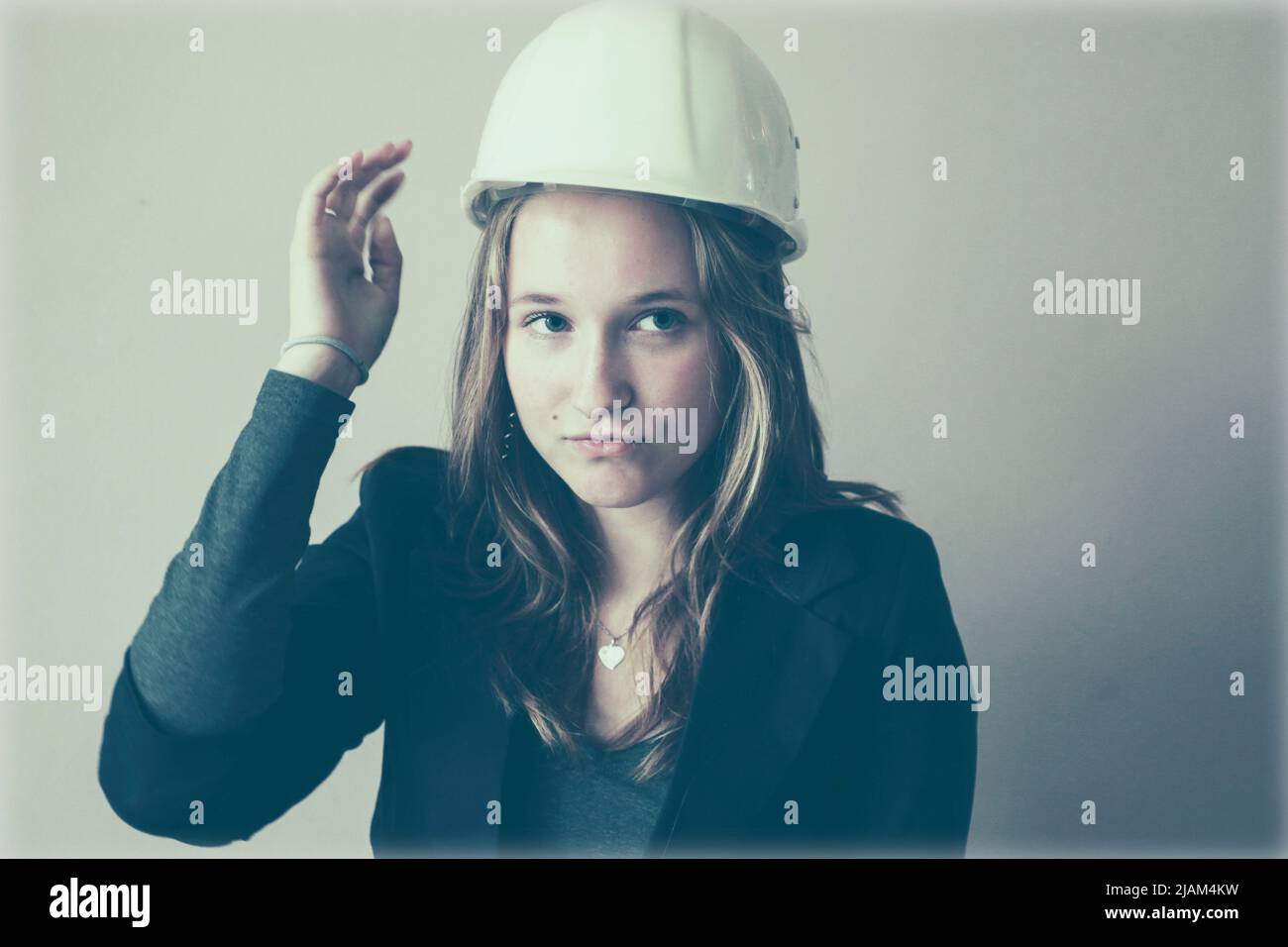 Young woman with hard hat Stock Photo