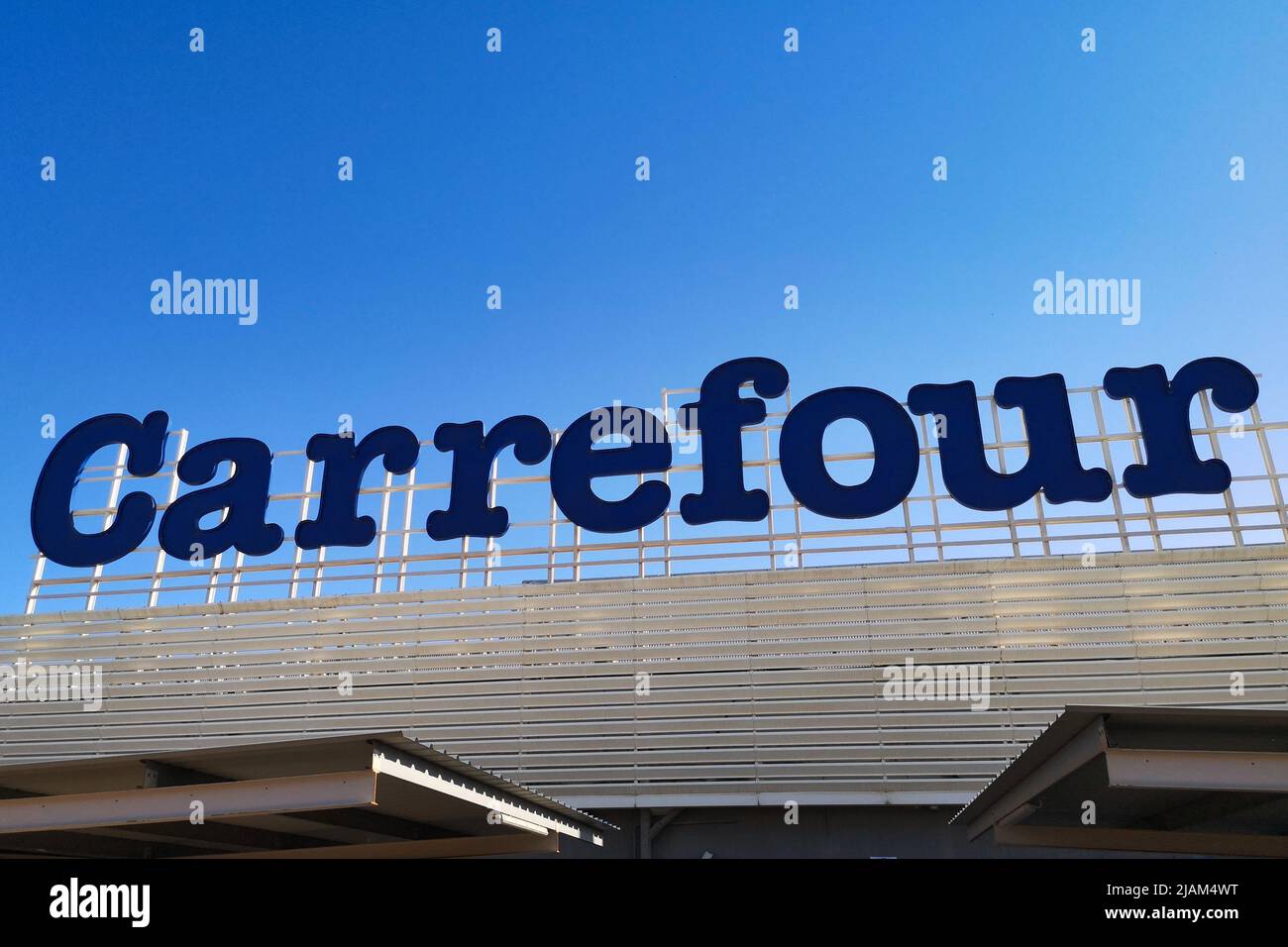 Logo of the Carrefour hypermarket. Malaga, Spain. Stock Photo