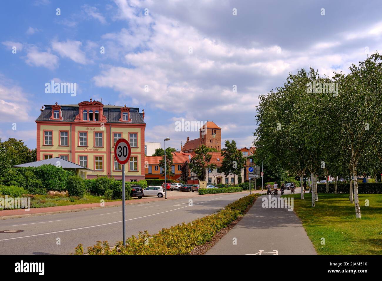 Streetscape of Hotel Harmonie and St. George's Church in the historic town centre of Waren an der Müritz, Mecklenburg-Western Pomerania, Germany. Stock Photo