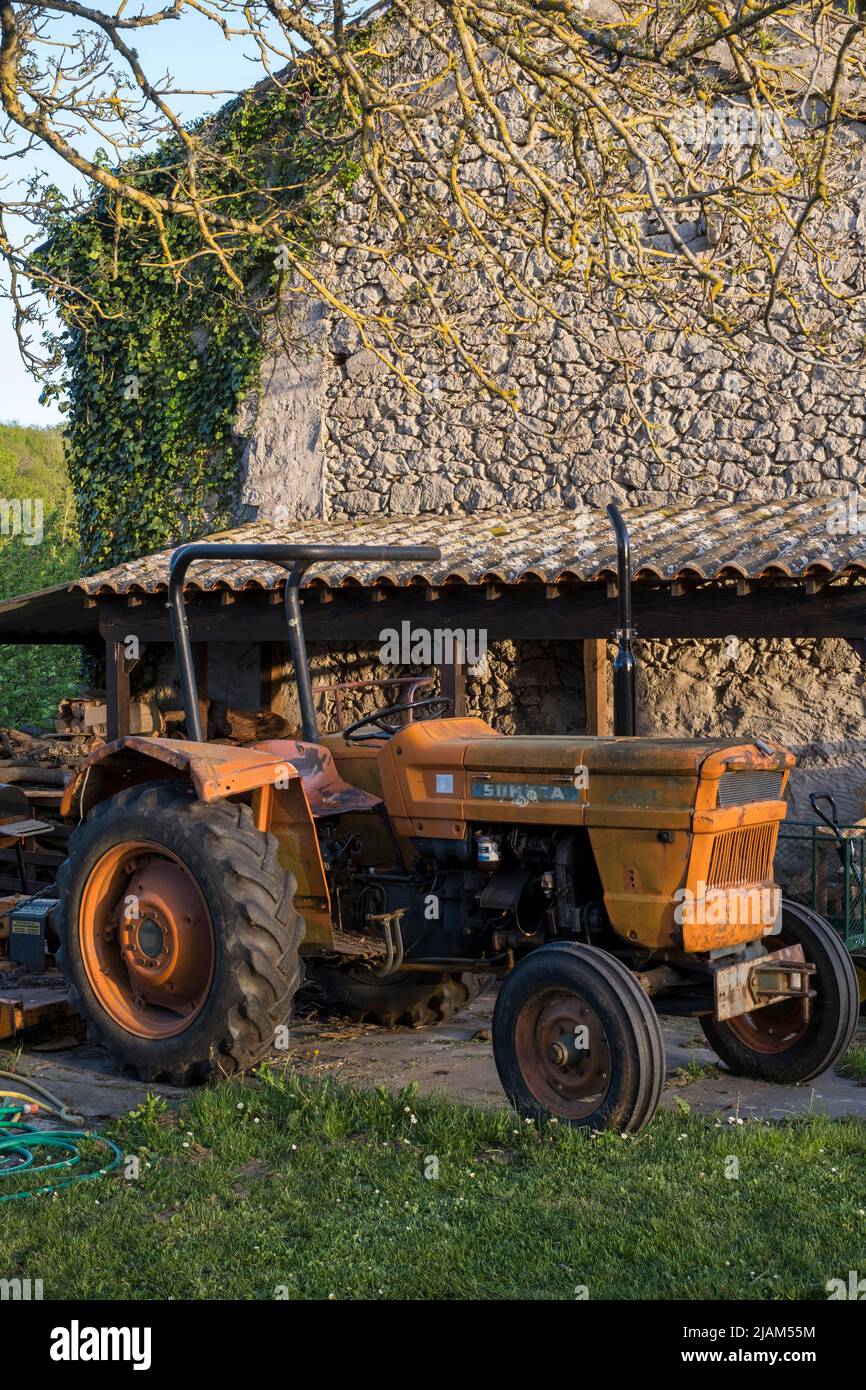 Old tractor in rural France Stock Photo
