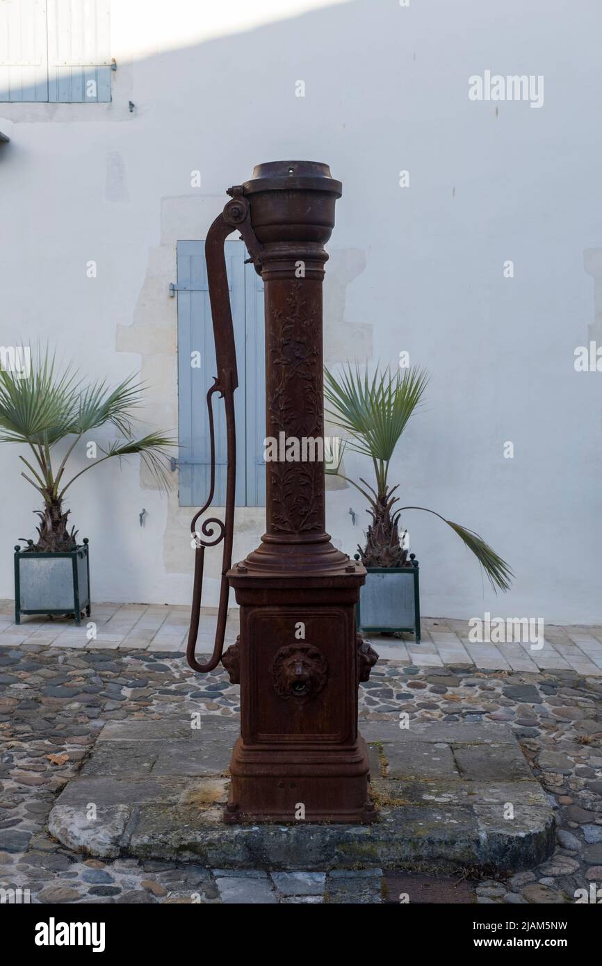 Old well pump in Saint-Martin-de-Re, in the west of France Stock Photo