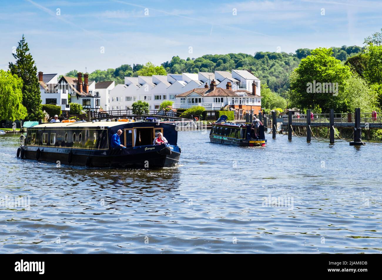Narrowboats sailing from Marlow lock along River Thames. Marlow, Buckinghamshire, England, UK, Britain Stock Photo