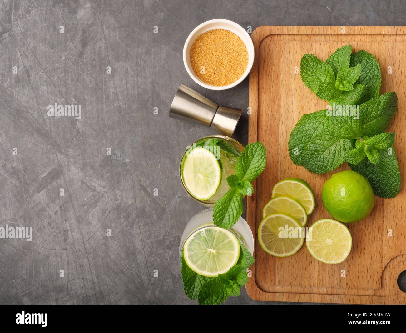Mojito or virgin mojito long rum drink with fresh mint, lime juice, cane sugar and soda. Stock Photo