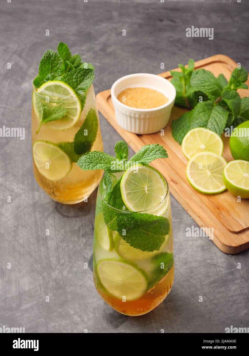 Mojito or virgin mojito long rum drink with fresh mint, lime juice, cane sugar and soda. Stock Photo