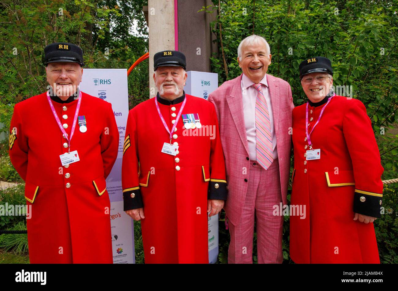 Actor and television presenter, Christopher Biggins with Chelsea Pensioners at the RHS Chelsea Flower Show. Stock Photo