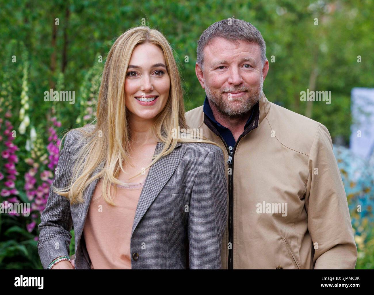 Film Director, Producer, screenwriter and businessman, Guy Ritchie with his wife, Jacqui Ainsley, a model. Stock Photo