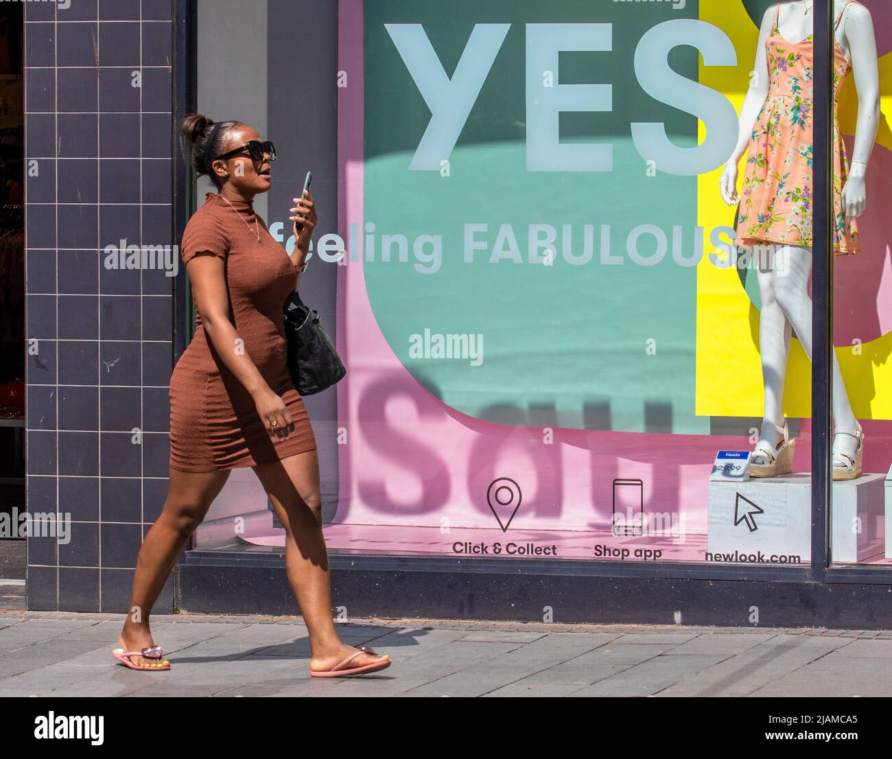 Southport, Merseyside.  Uk Weather.  31 May 2022. Shops, shoppers, shopping with a sunny start to the day in the north-west coastal resort. Temperatures are expected to rise with the prospect of a fine bright holiday Jubilee celebration weekend.  Credit; MediaWorldImages/AlamyLiveNews Stock Photo