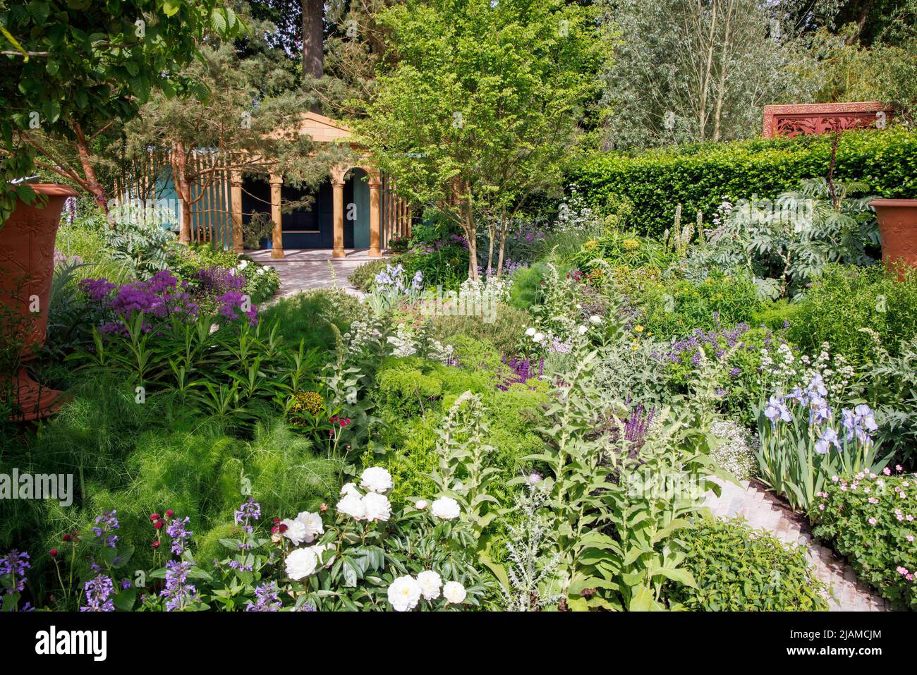 The RNLI Garden at RHS Chelsea Flower Show. The Loggia is made from Green Oak. Scots Pine and Oak trees feature which are used to construct lifeboats. Stock Photo