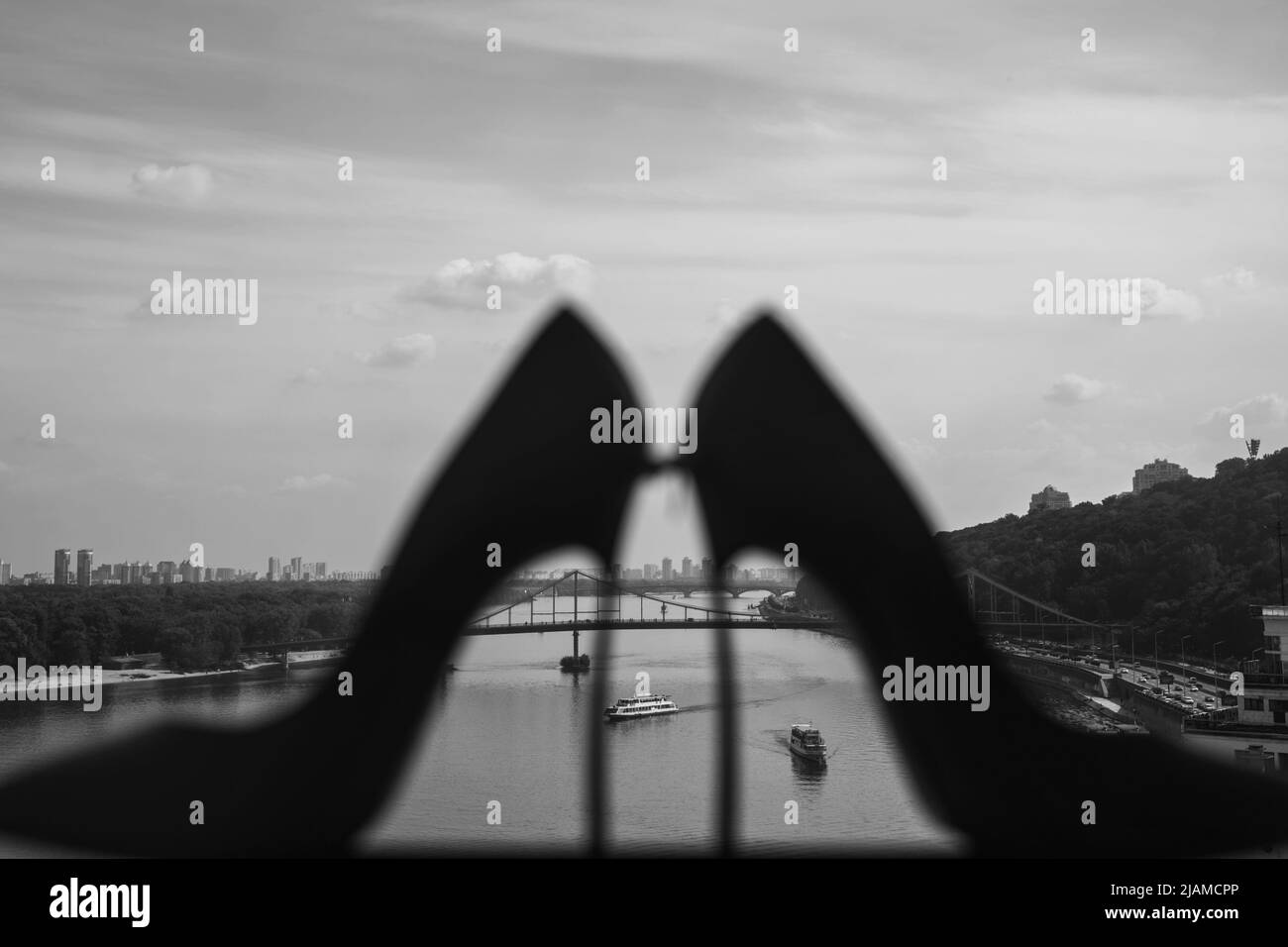 River and city view through wedding shoes. Stock Photo