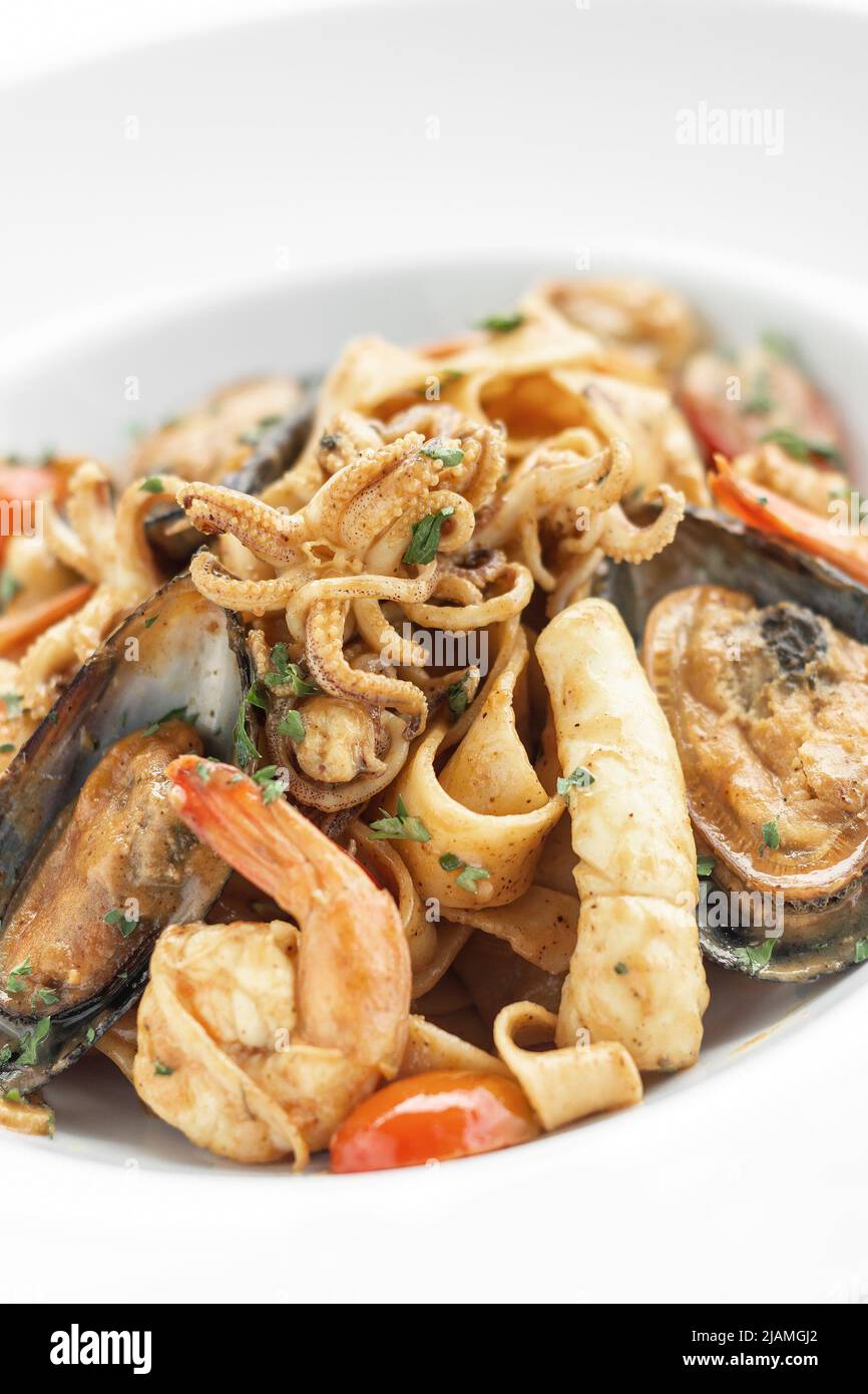mixed seafood traditional stir fry laksa spicy curry in malaysia Stock Photo