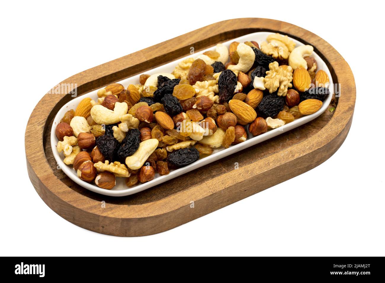 Mixed nuts on white background. Nuts, walnuts, raisins and cashews. close up Stock Photo