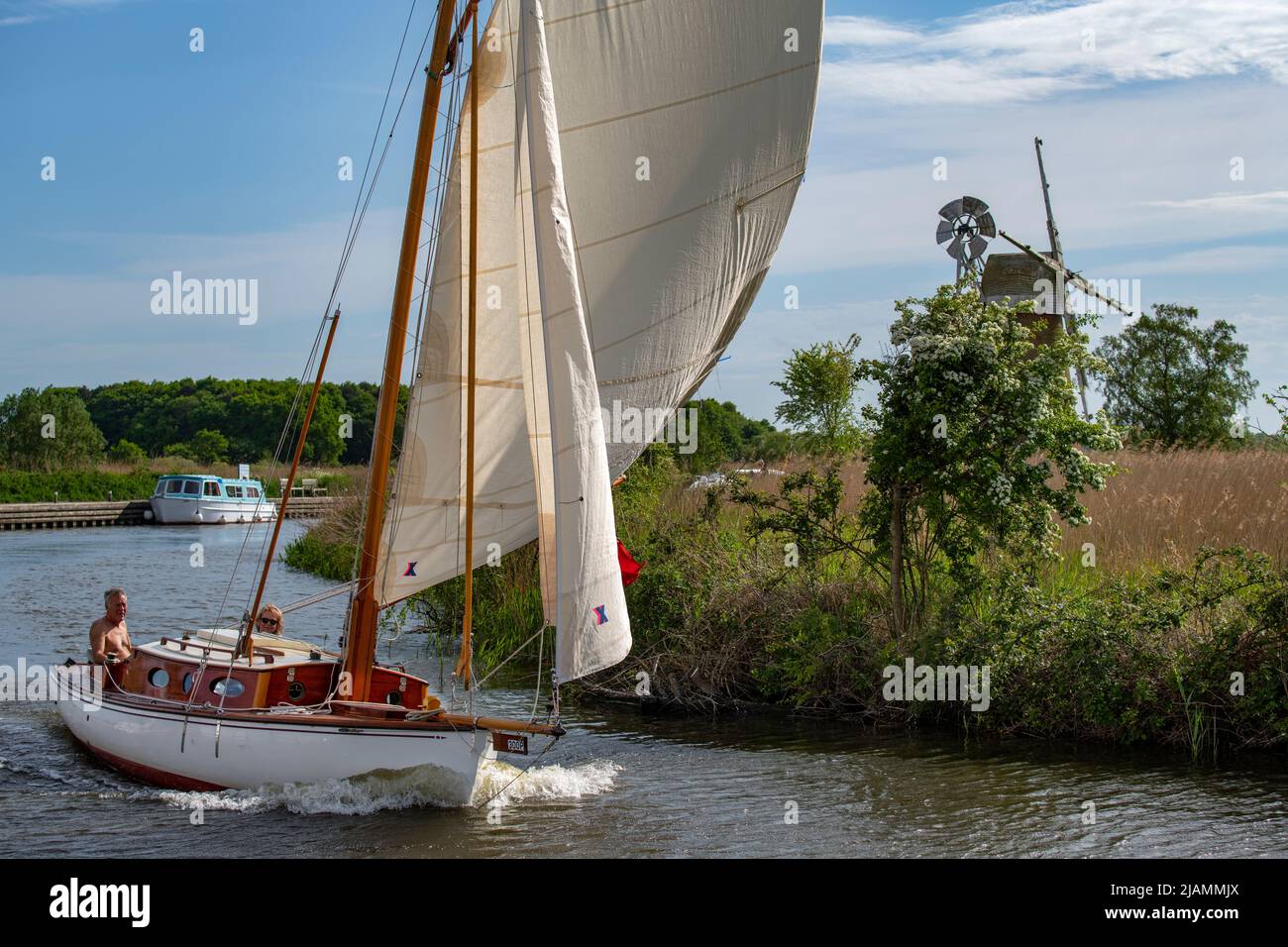 Norfolk Broads Norfolk England May 2022 Yachts and Boats on the River Ant, part of the Norfolk Broads leading to How Hill showing Turf Fen Drainage Mi Stock Photo