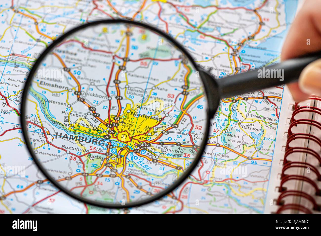 map of Hamburg in Germany through magnifying glass, concept of planning ...