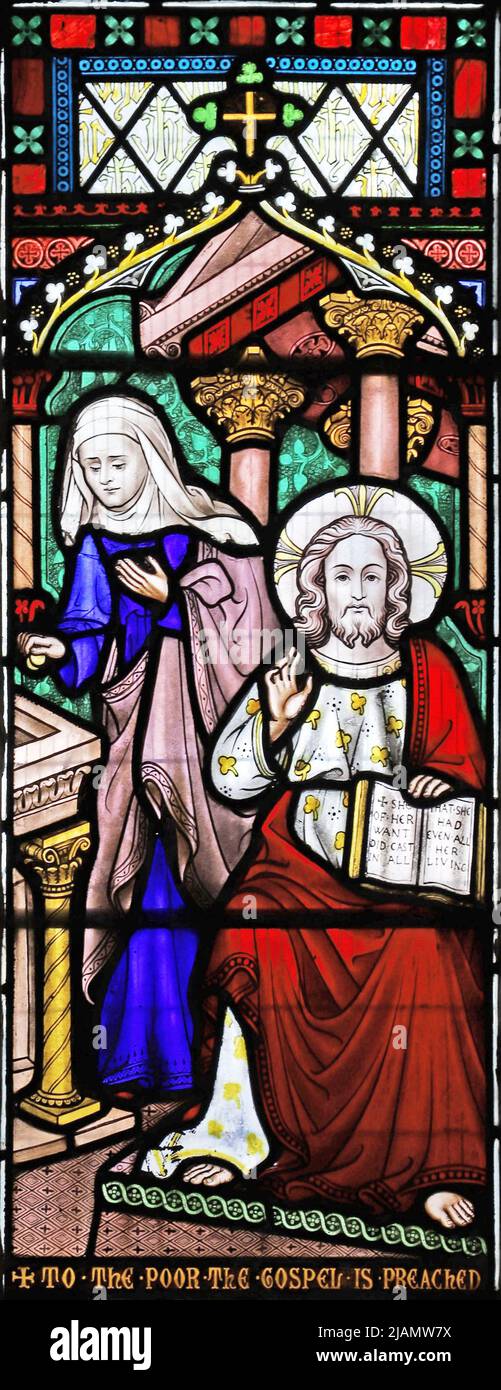Stained glass by Frederick Preedy depicting the Parable of the Widow's Offering or Widow's Mite, All Saints Church, Church Lench, Worcestershire Stock Photo