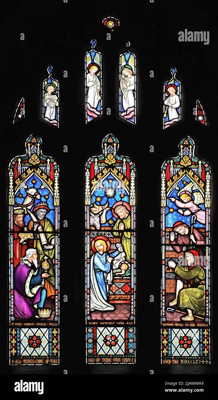 A stained glass window by Frederick Preedy depicting Adoration of the Magi and Shepherds at the Nativity, All Saints Church, Church Lench, Worcestersh Stock Photo