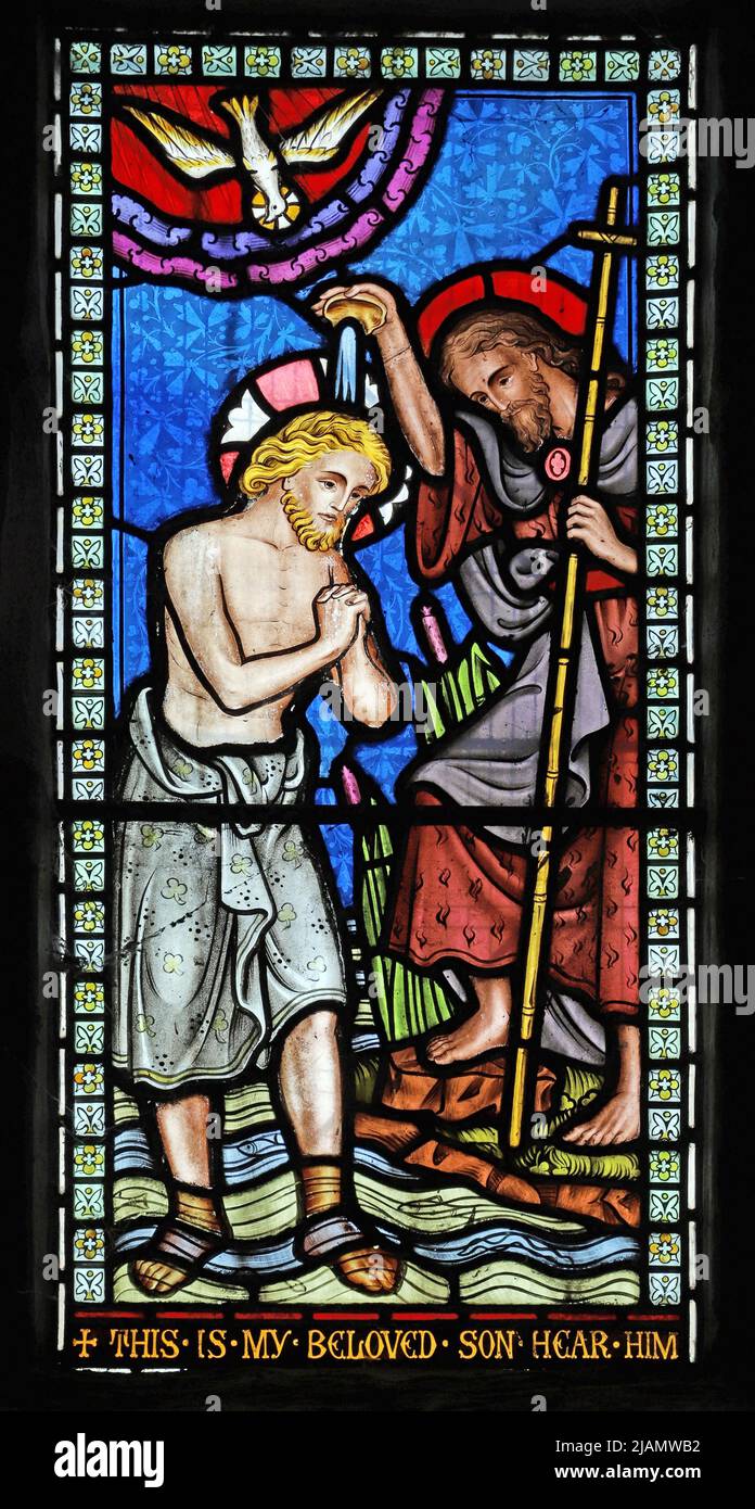 A stained glass window by Frederick Preedy depicting the baptism of Jesus, All Saints Church, Church Lench, Worcestershire Stock Photo