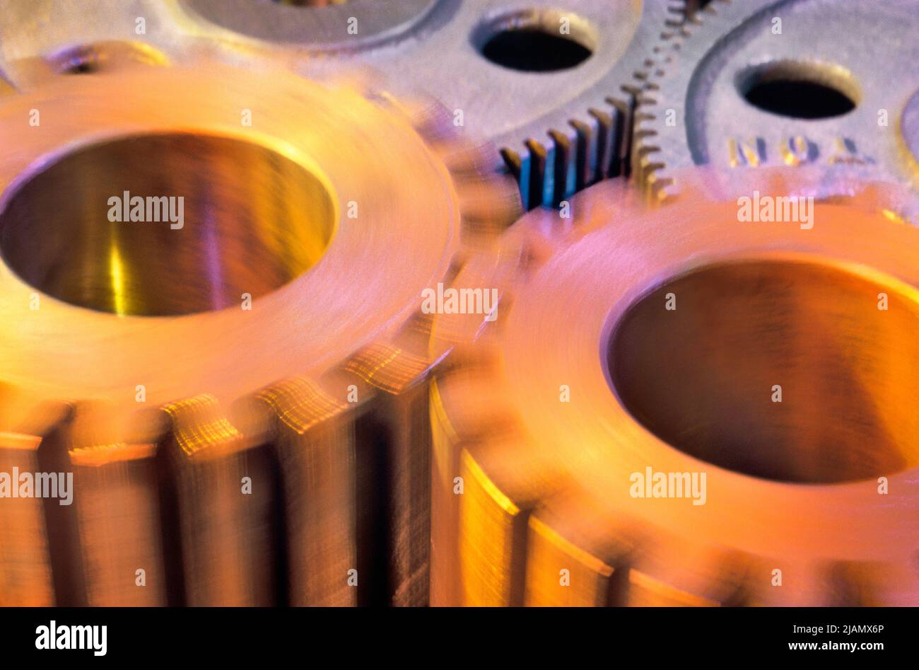 Gears spinning. Industrial gears turning. Movement and motion Stock Photo