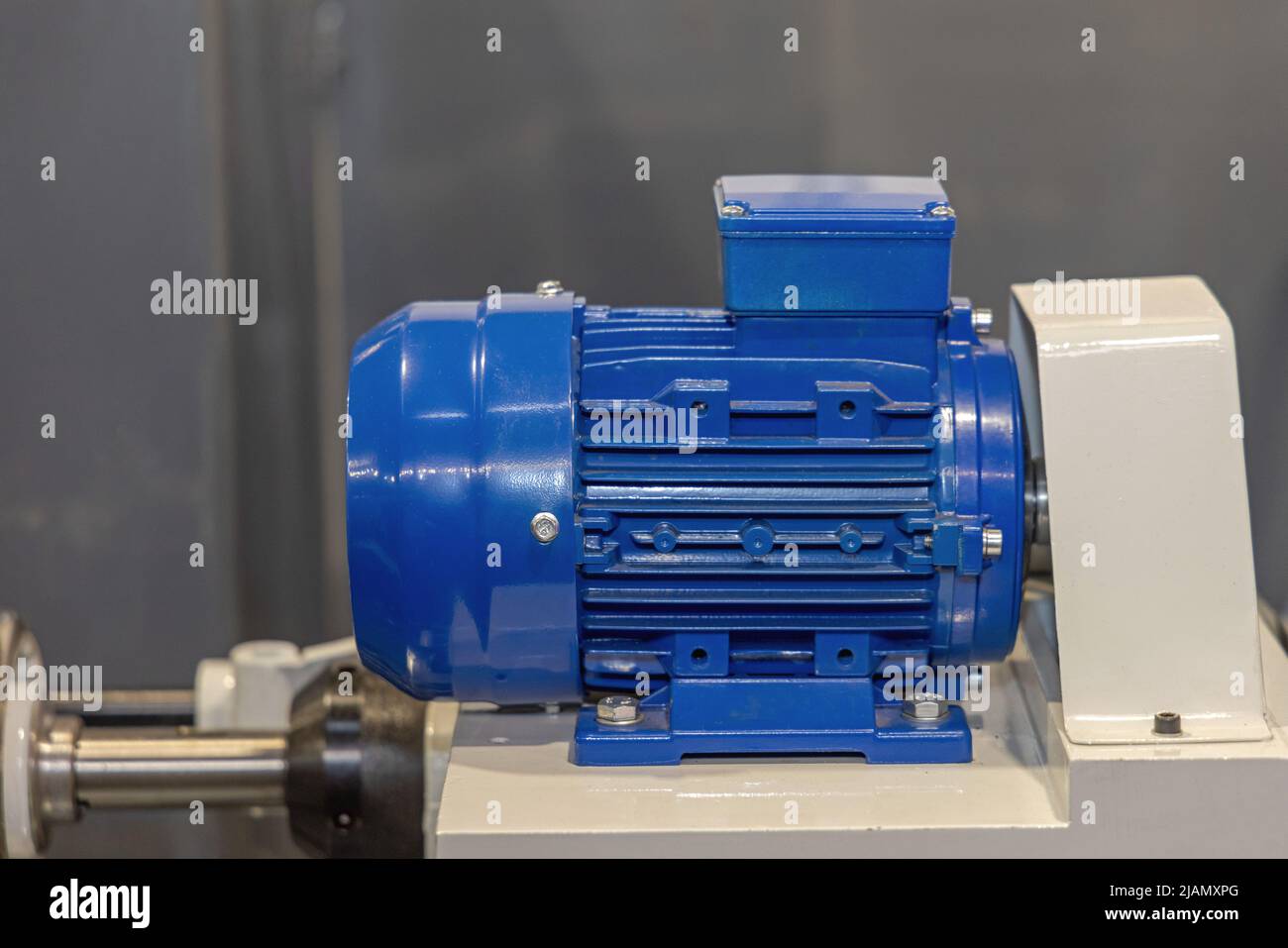 Blue Industrial Electric Motor at Machine Production Unit Stock Photo