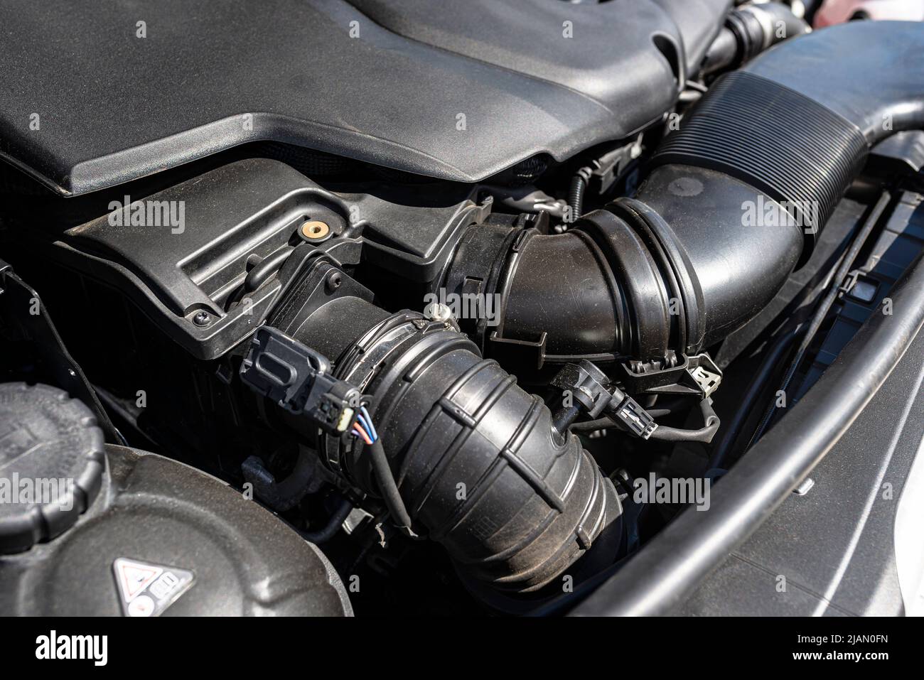 Plastic air intake pipes for a modern 2.2 liter diesel engine with a capacity of 220 horsepower. Stock Photo