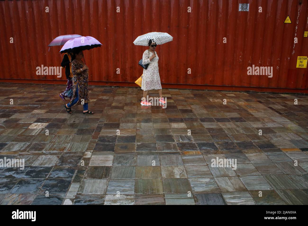 On May31, 2022 in Kathmandu, Nepal.People carrying umbrella walks on