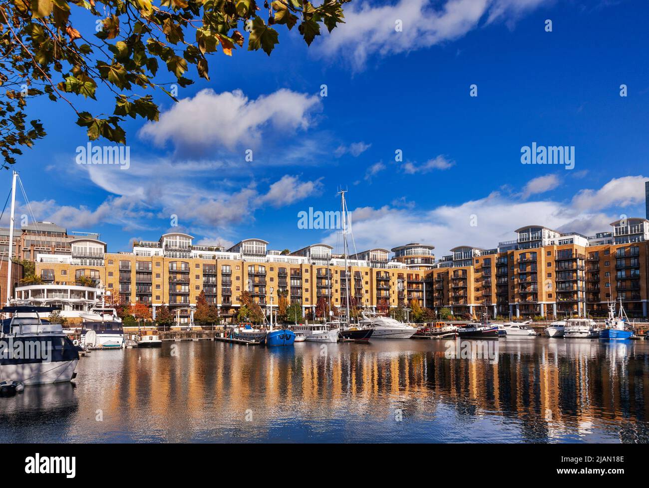 Luxury waterside housing and leisure complex with yachting marina at the St Katharine Docks, Tower Hamlets, East End, London, England, UK Stock Photo