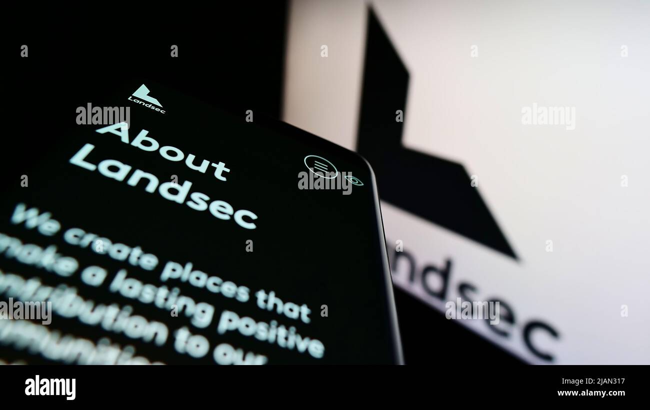 Smartphone with website of company Land Securities Group plc (Landsec) on screen in front of business logo. Focus on top-left of phone display. Stock Photo