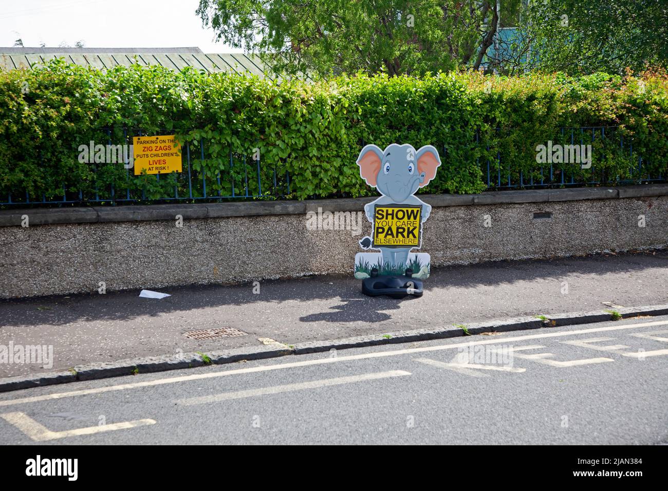 Road safety parking signs outside primary school, Edinburgh, Scotland