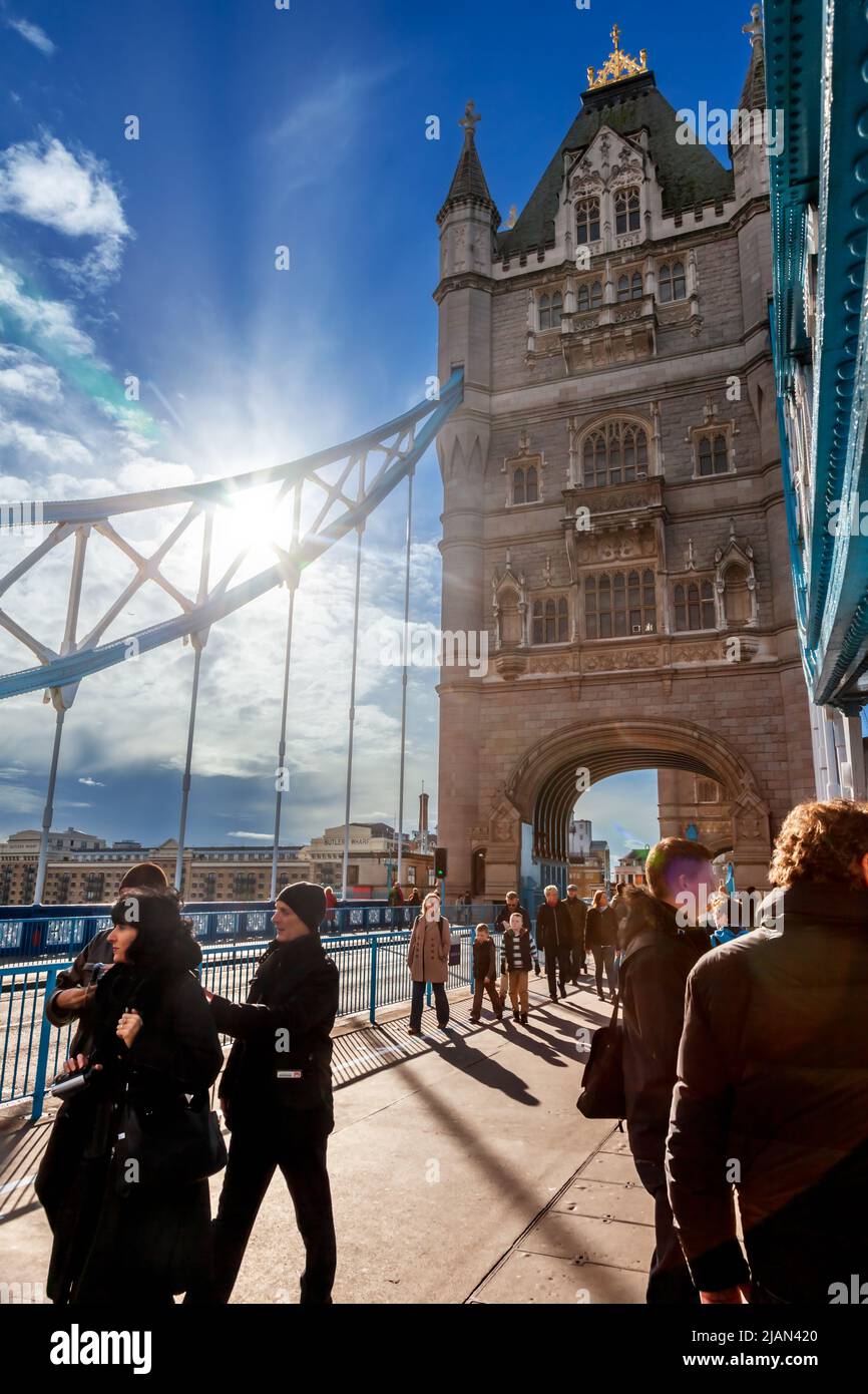 London, UK - Nov 1, 2012: Tourists and Londoners at the Tower Bridge on a nice sunny autumn day Stock Photo