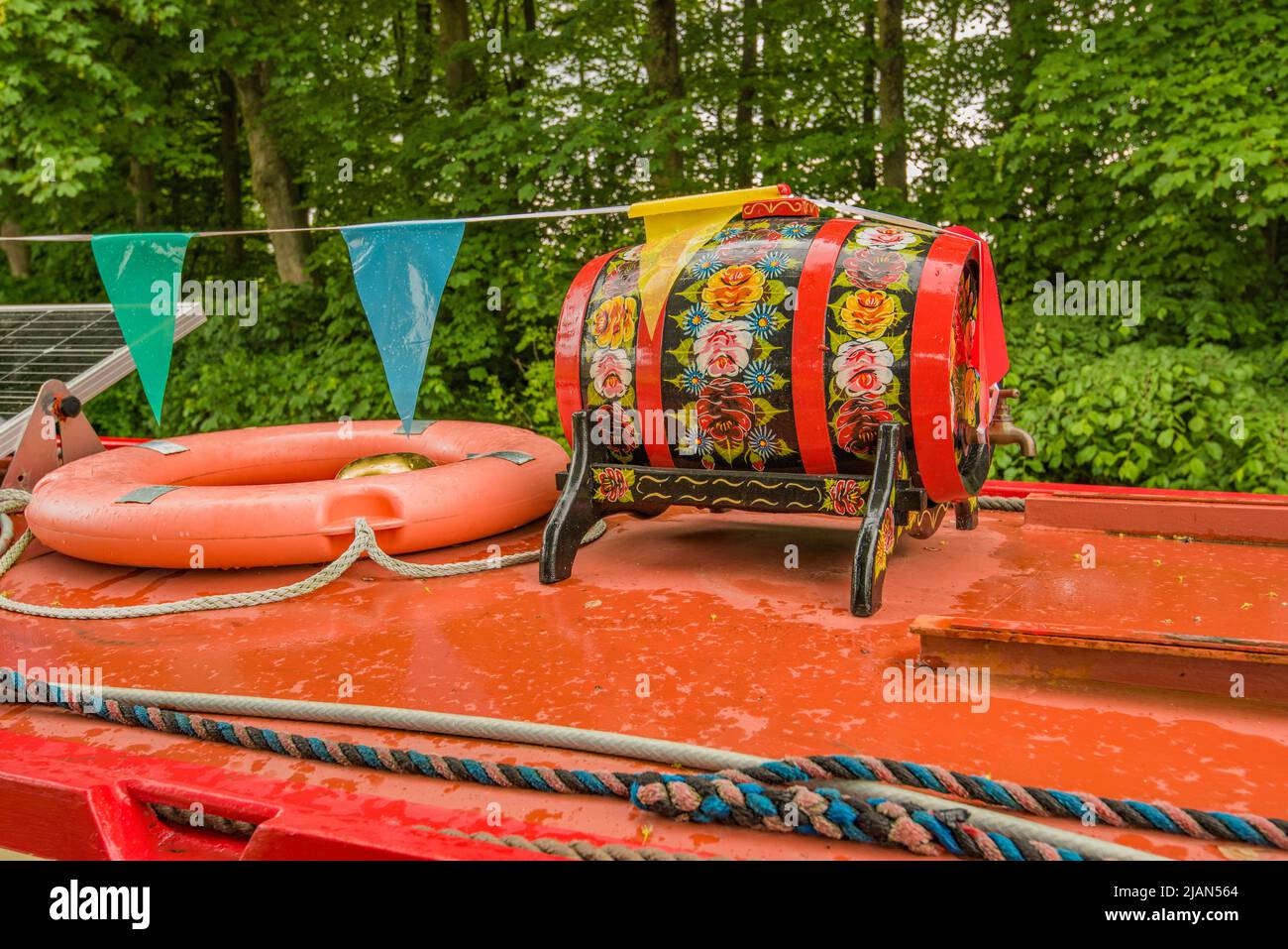 Beautifully  hand-painted traditional style canal and folk art barrel as  narrowboat decoration. Narrowboat moored in Gargrave 31st May 2022. Stock Photo