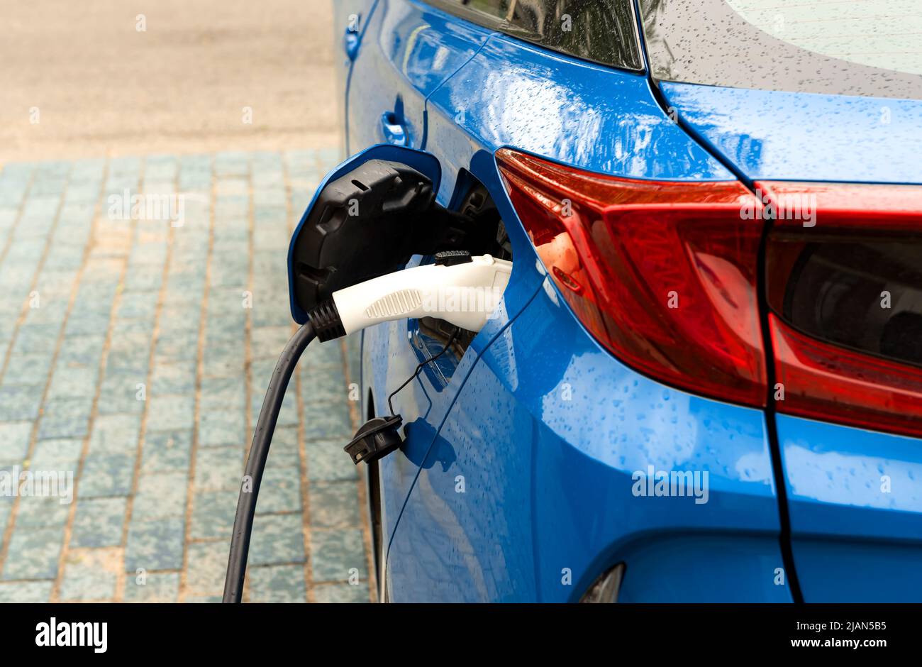 Electric car at the charging station. Ecology. Eco-friendly transport ... - Luxury Eco Properties With Electric Car Charging