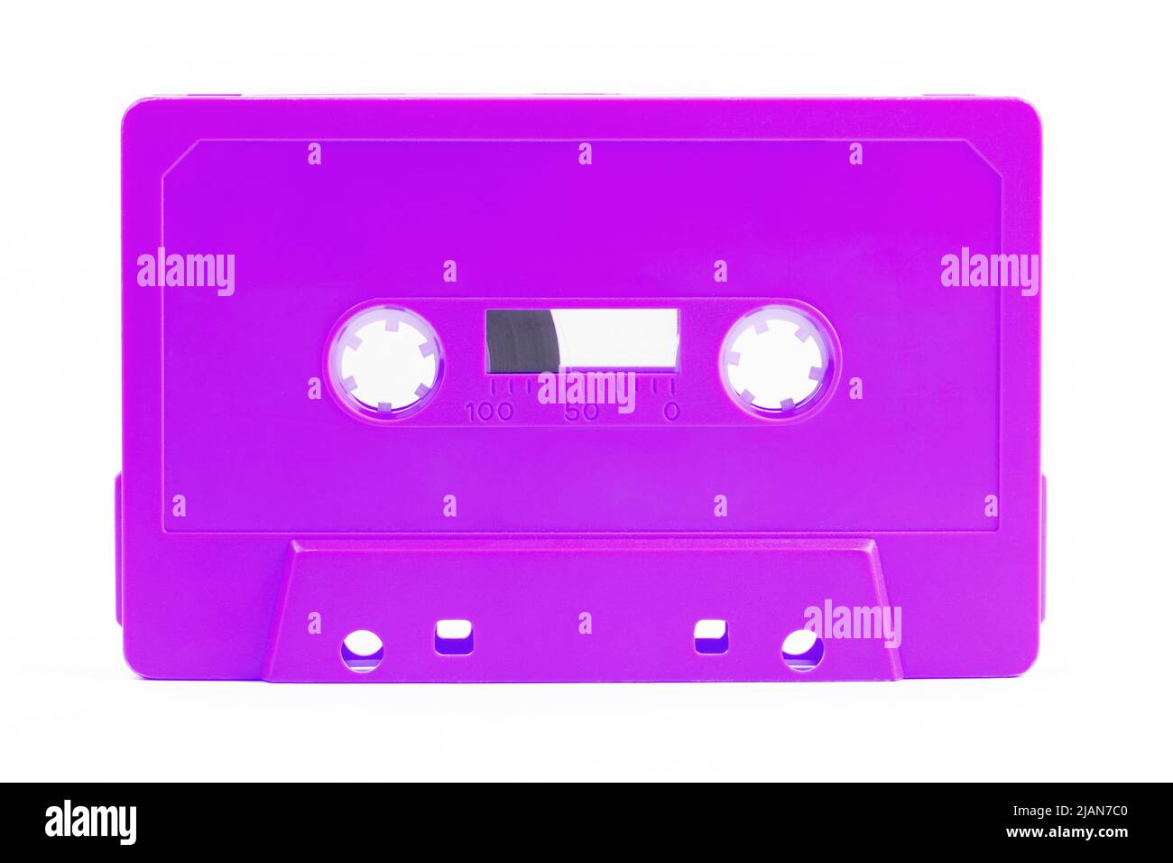 One single simple funky light neon purple analog audio cassette tape object isolated on white, cut out, nobody. Retrowave, synthwave retro vintage 80s Stock Photo