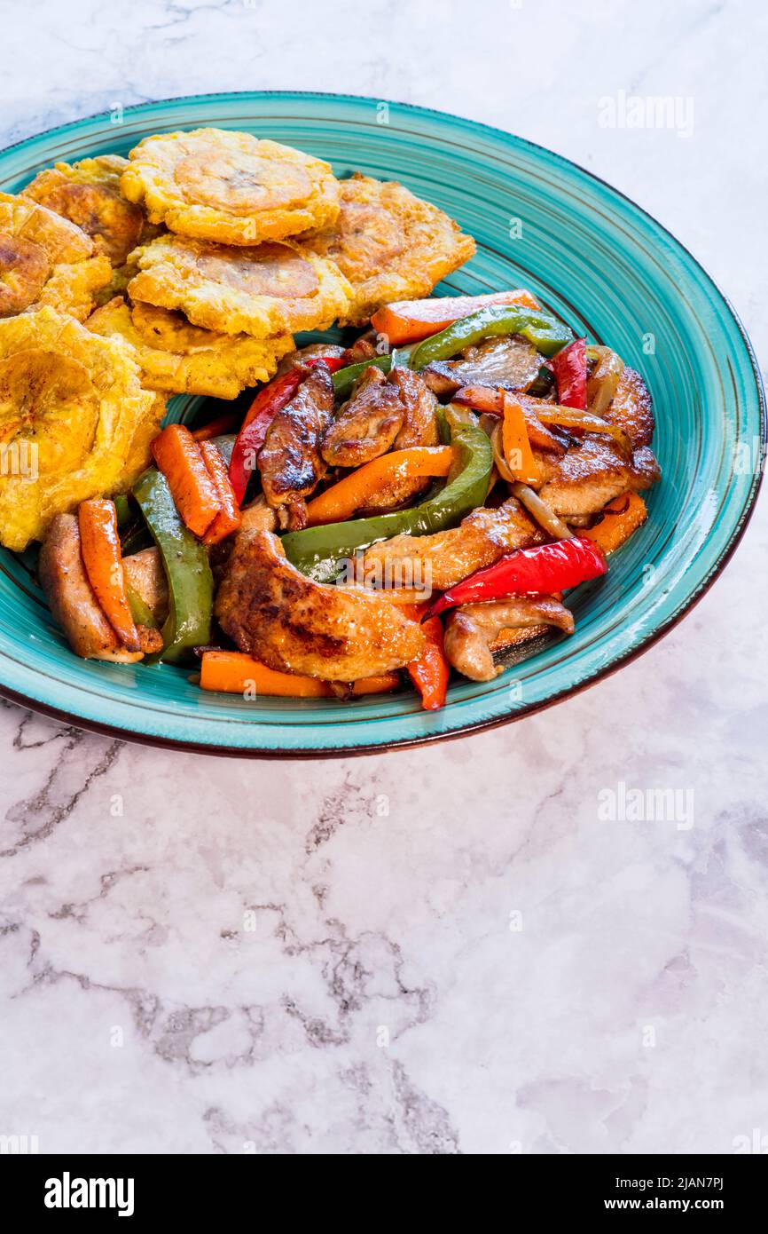 Chopped steak or Bistec Picao and patacones or tostones are fried green plantain slices, made with green plantains, Typical latin food, Panamá Stock Photo