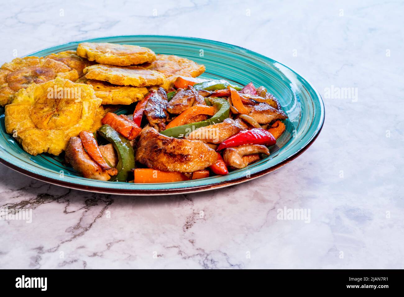 Chopped steak or Bistec Picao and patacones or tostones are fried green plantain slices, made with green plantains, Typical latin food, Panamá Stock Photo