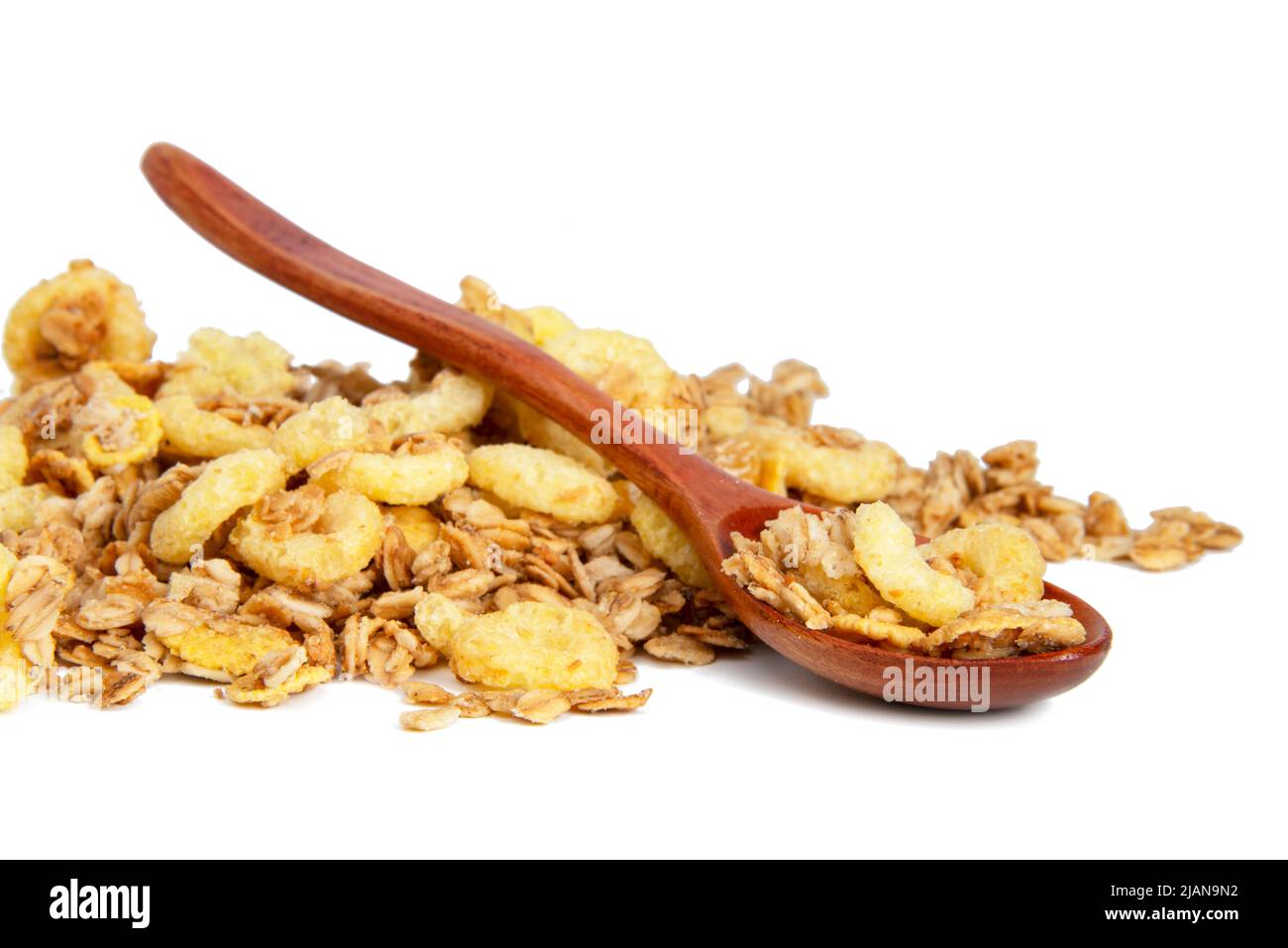 Oatmeal cereal breakfast in wooden spoon isolated on the white background Stock Photo