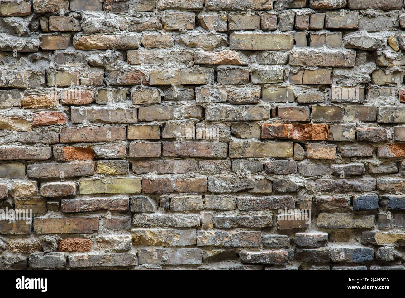 Background of old vintage dirty brick wall with peeling plaster ...