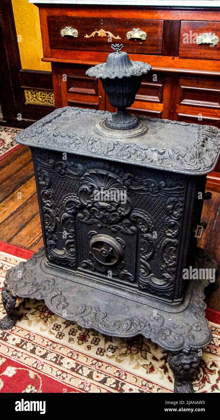 Ornate antique cast iron stove used on sailing ships Stock Photo