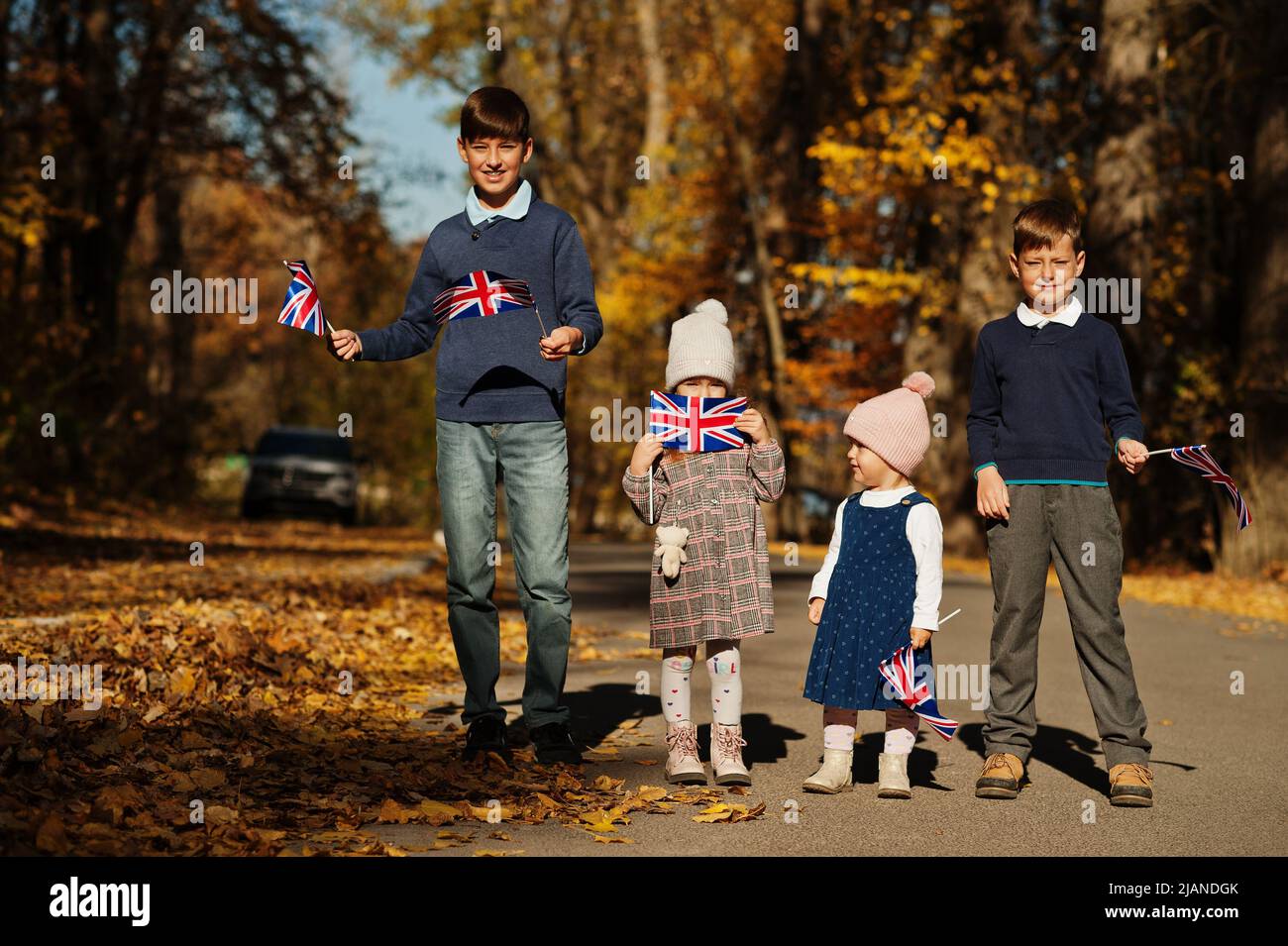 National holiday of United Kingdom. Four kids with british flags in ...