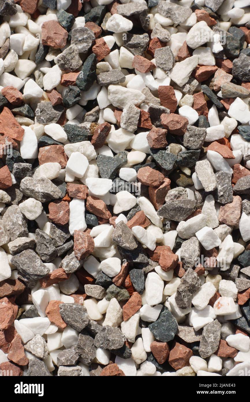 Decorative coloured stone, gravel used in landscape gardening. Stock Photo