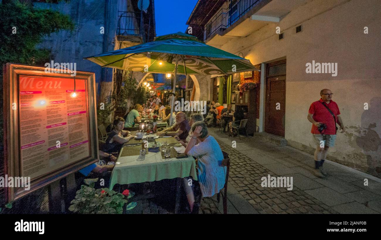 Alleyway between Rabbi Ber Meisels Street and Józefa Street, garden of  the „Stajnia” cafe Stock Photo