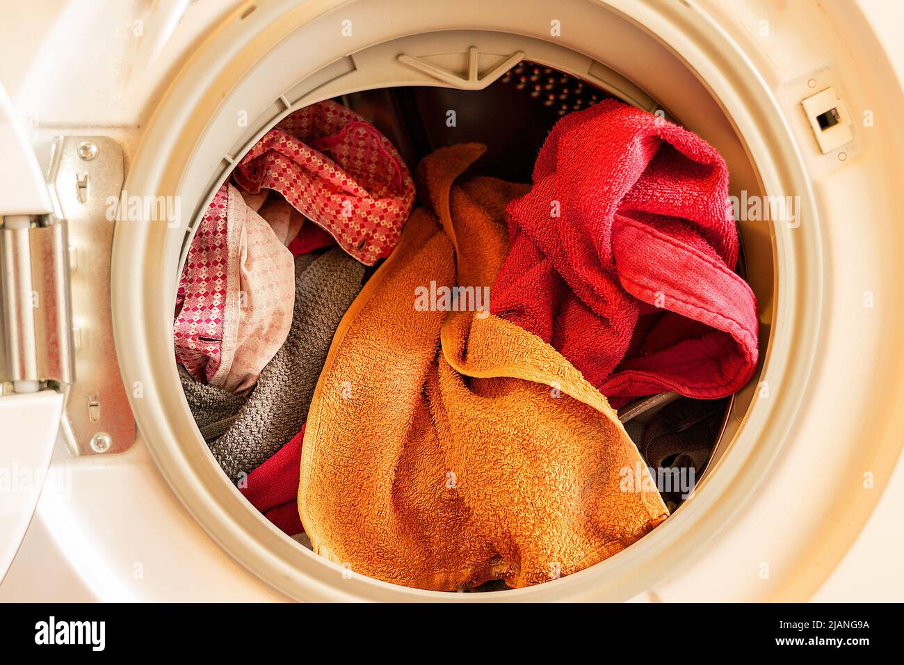 colored clothes inside the door of a washing machine Stock Photo Alamy