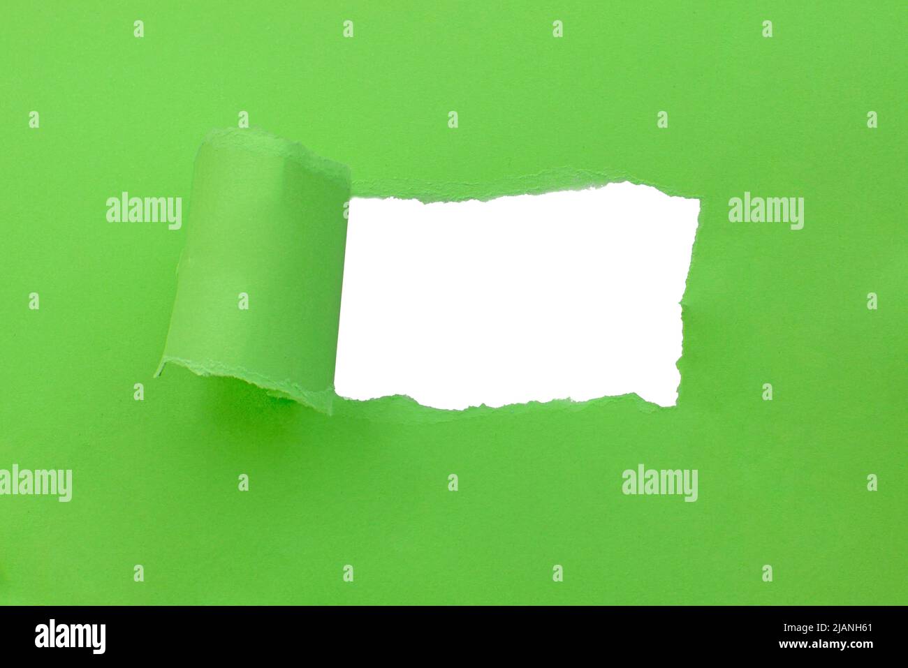 Paper green color background with hole copyspace Stock Photo - Alamy