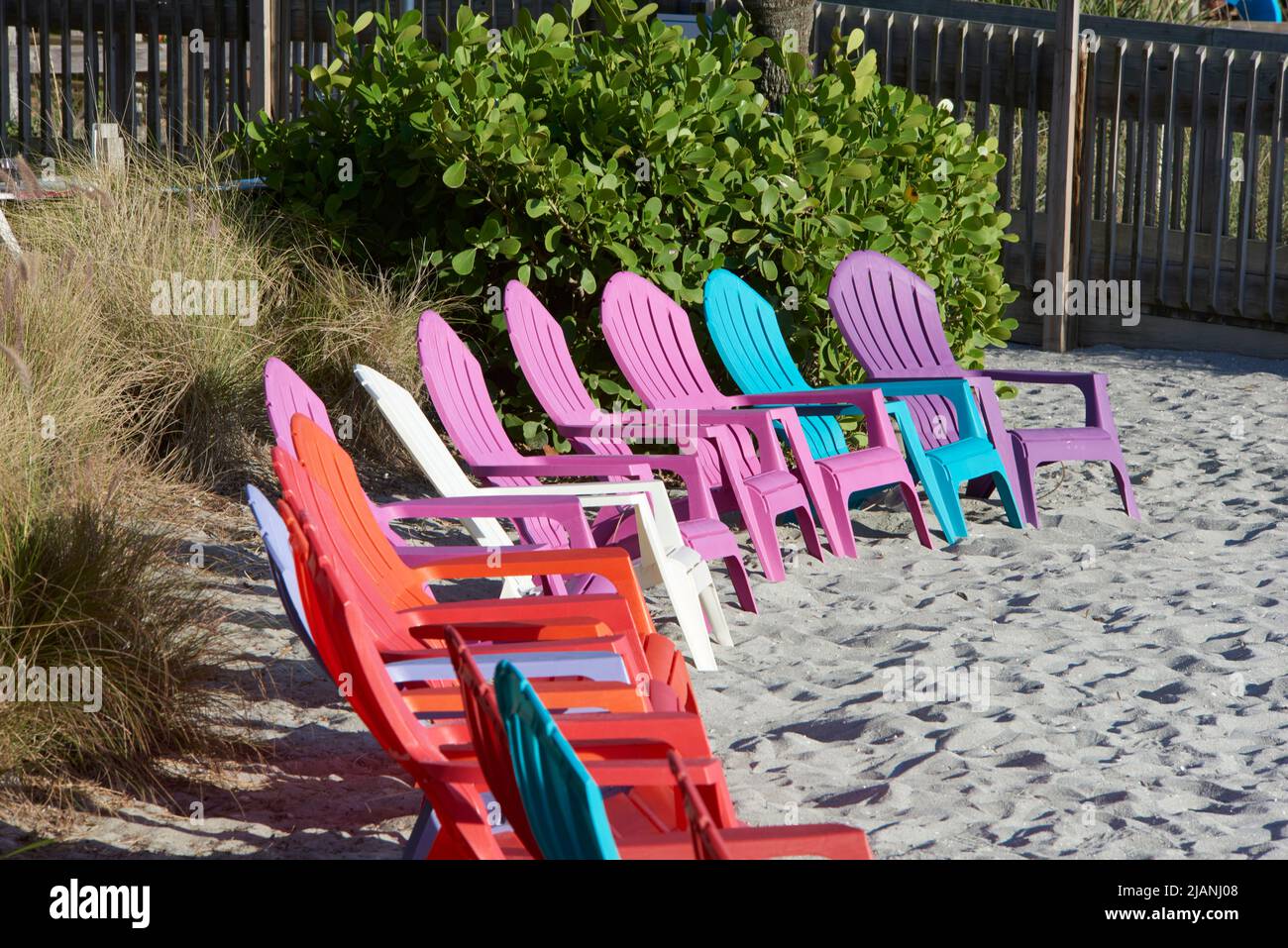 colorful lounge chairs sitting on beach Stock Photo Alamy