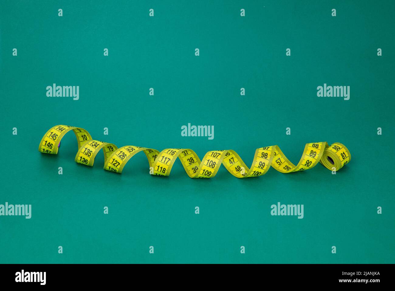 Colorful tape measure spiral with copyspace background Stock Photo Alamy